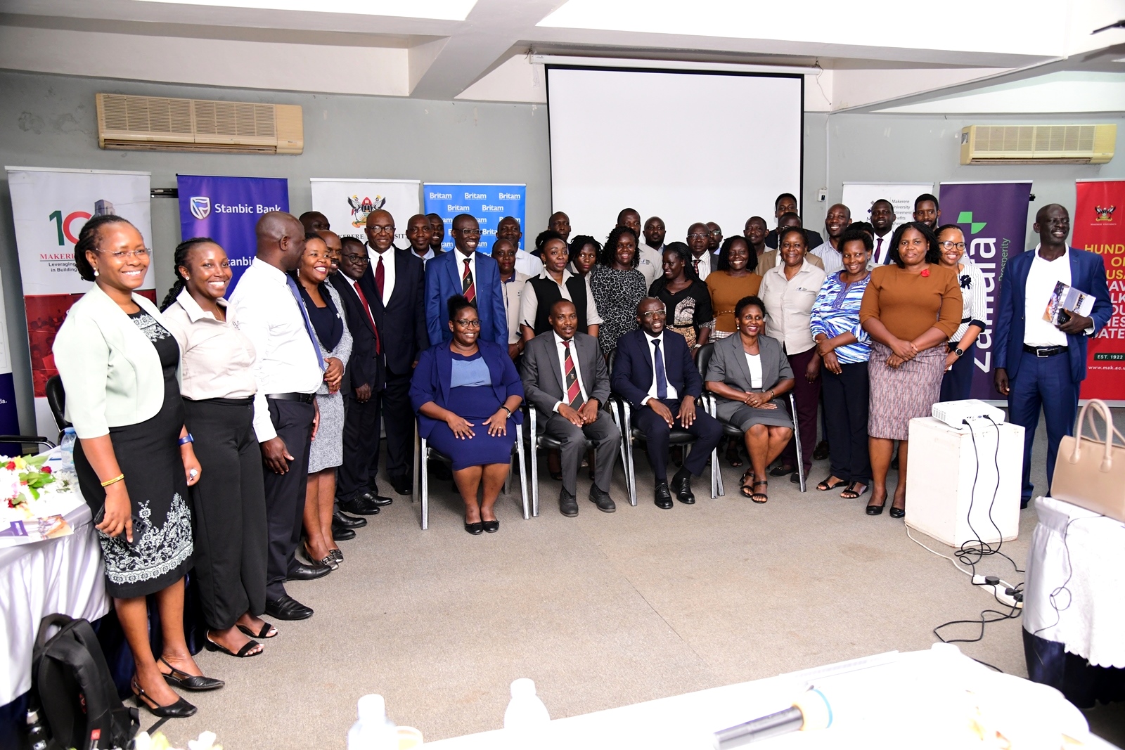 Members of Council and Management join MURBS Trustees, Ambassadors and service providers in a group photo after the presentation of the Scheme's performance for FY 2022/2023 on 24th October 2023. MURBS Presentation of Performance FY 2022/2023, 24th October 2023, Telepresence Centre, Level 2, Senate Building, Makerere University, Kampala Uganda. East Africa.