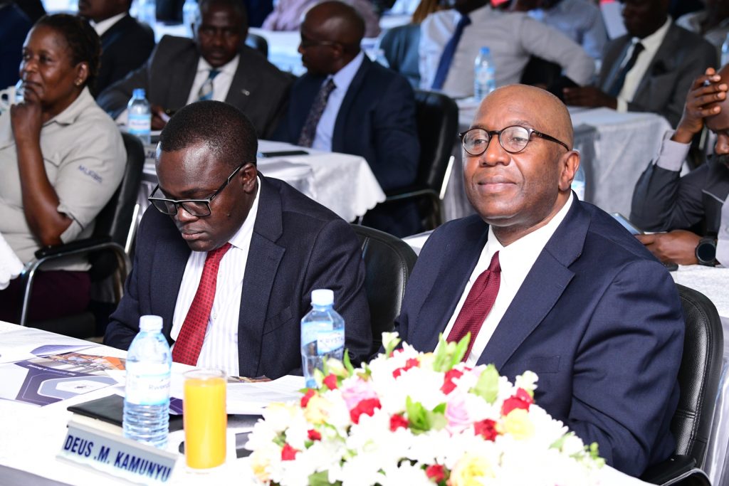 Mr. George Bamugemereire (Right) and Dr. Deus Kamunyu Muhwezi follow proceedings. MURBS Presentation of Performance FY 2022/2023, 24th October 2023, Telepresence Centre, Level 2, Senate Building, Makerere University, Kampala Uganda. East Africa.