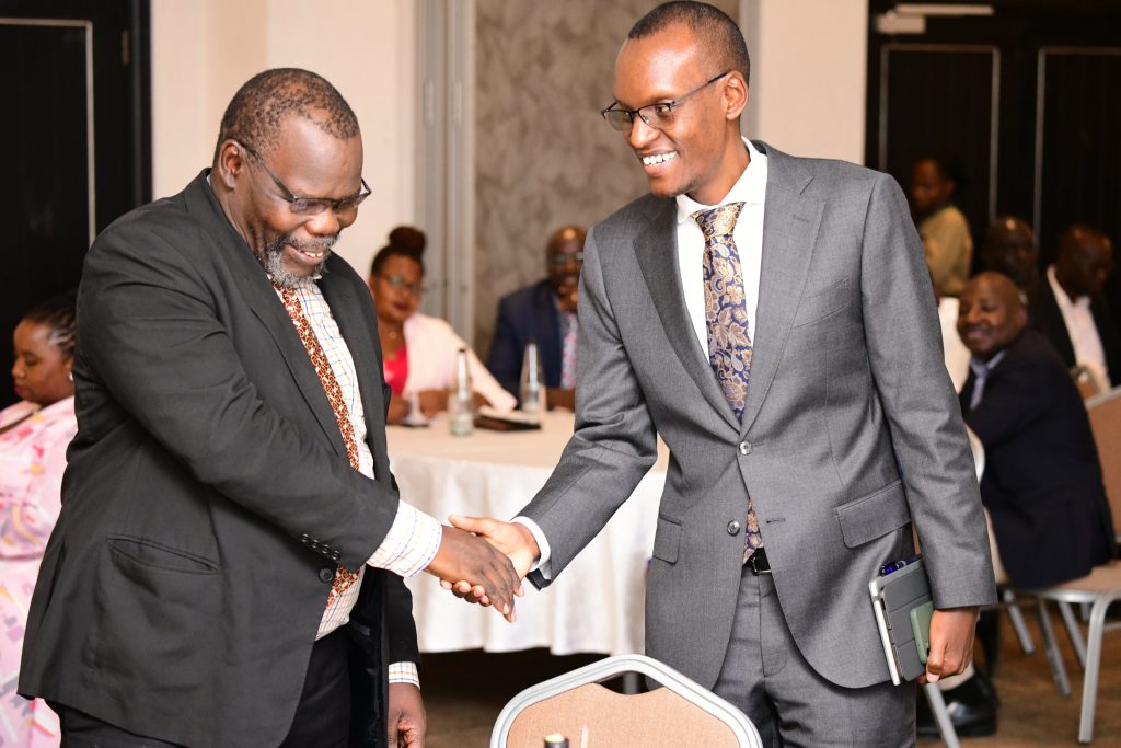 The Chairperson Staff Appeals Tribunal-Dr. Henry Onoria (Left) shakes hands with the Chairperson Appointments Board-Mr. Edwin Karugire (Right) at the swearing-in ceremony. Makerere University Staff Appeals Tribunal Swearing-In Ceremony, 16th November 2023, Mestil Hotel, Kampala Uganda.