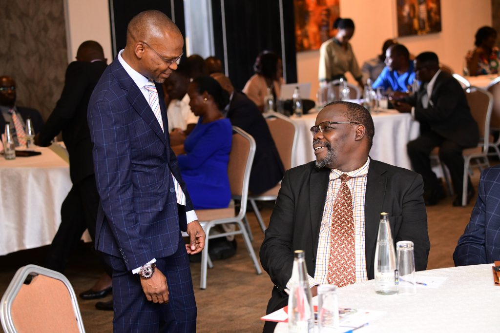 The Acting Vice Chancellor-Prof. Umar Kakumba (Left) interacts with Dr. Henry Onoria during the event. Makerere University Staff Appeals Tribunal Swearing-In Ceremony, 16th November 2023, Mestil Hotel, Kampala Uganda.