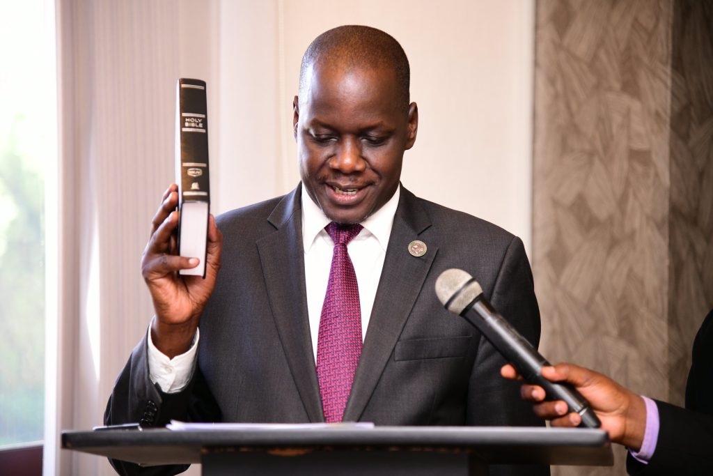 Rt. Hon. Daniel Fred Kidega, Vice Chairperson of Council and Council Representative to the Staff Appeals Tribunal swears in. Makerere University Staff Appeals Tribunal Swearing-In Ceremony, 16th November 2023, Mestil Hotel, Kampala Uganda.