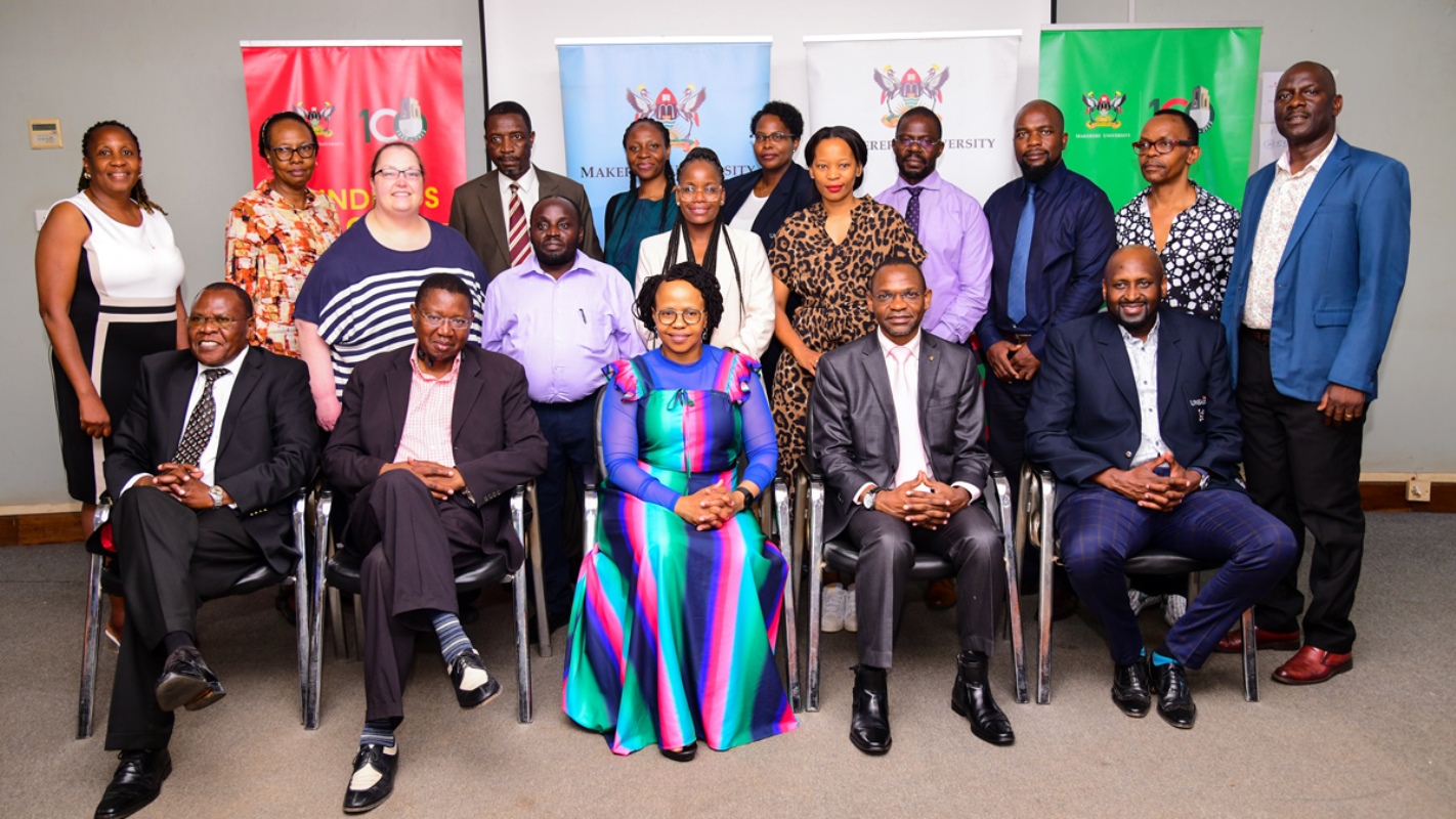 Front Row: Ag. Vice Chancellor-Prof. Umar Kakumba (2nd R), UNISA Head of Delegation-Prof. Tennyson Mgutshini (R), Prof. Thenjiwe Meyiwa (C), Dr. Maxwell Otim Onapa (L) and other leaders from Makerere and UNISA pose for a group photo after the meeting on 2nd November 2023, Telepresence Centre, Senate Building, Makerere University. Kampala Uganda, East Africa.