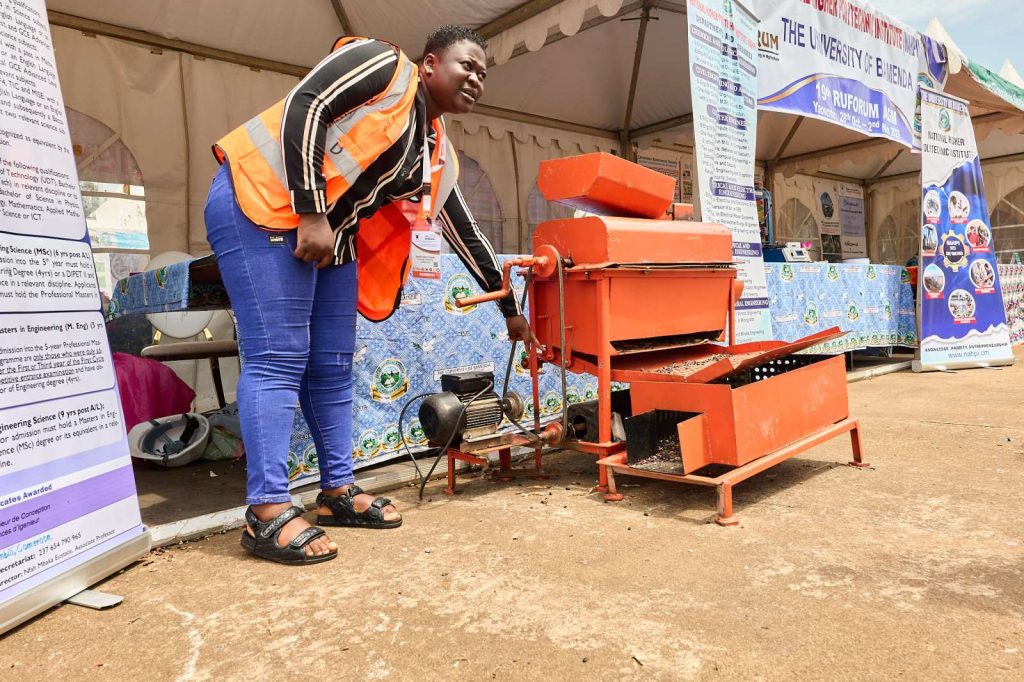 An exhibitor showcasing her work at the 19th RUFORUM Annual General Meeting in Yaoundé, Cameroon.