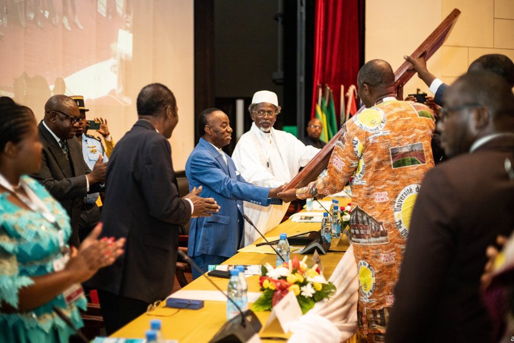 Professor Jacques Fame Ndongo, Cameroon's State Minister, Ministry of Higher Education, receiving the Contemporary painting on behalf His Excellency Paul Biya, President of the Republic of Cameroon.