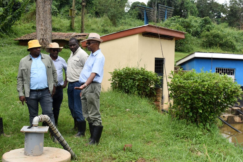 Prof. Tukamuhabwa explaining how the solar irrigation facility works. Africa Soybean Breeders Meeting, 28th November to 1st December 2023, Makerere University, MUARIK, Kampala Uganda, East Africa.