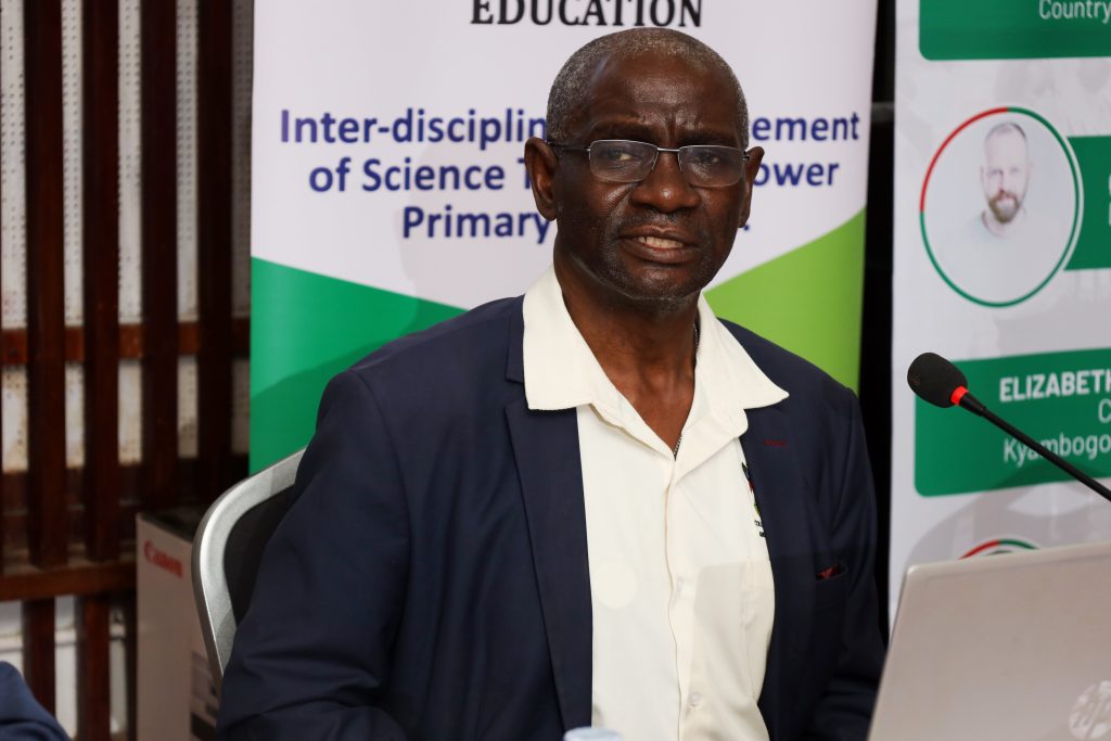 Dr Henry Busulwa the Principal Investigator, Mak-RIF Project on translating two resource books into Luganda and Lumasaaba languages following the thematic curriculum of lower primary Dissemination December 2023, AVU Conference Room, Makerere University, Kampala Uganda, East Africa.