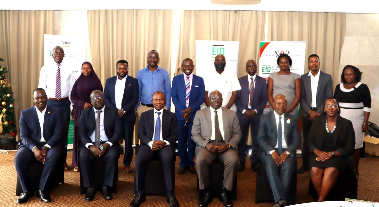 Panelists and research fellows in group photo with the centre Director and the Principal CoBAMS after the IGE Policy Dialogue on 20th December 2023 in Kampala. Sheraton Hotel, Uganda.