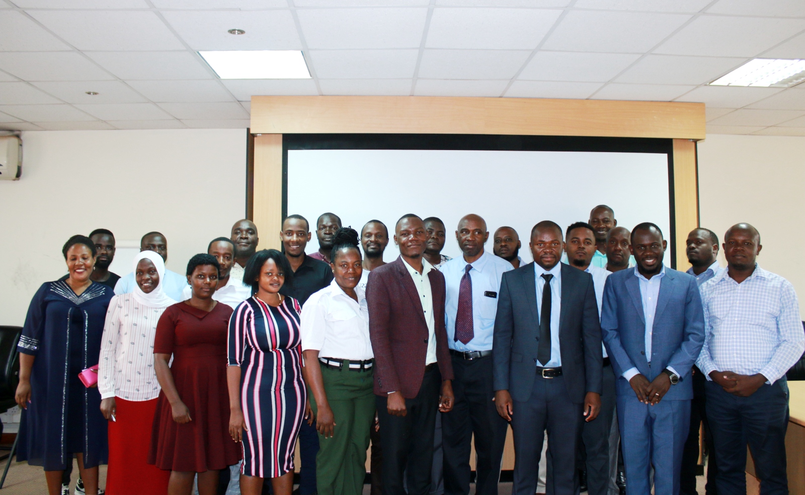 The Dean of the School of Economics, Prof. Ibrahim Mike Okumu (Front Row: 3rd Right) with the research team and participants that attended the dissemination workshop on December 13th 2023. “Promoting Domestic Tourism in Uganda, An Assessment of Economic Significance and Opportunities for Tourism Stakeholders in Uganda", Conference Hall, Level 2, School of Business, College of Business and Management Sciences (CoBAMS), Makerere University, Kampala Uganda, East Africa.