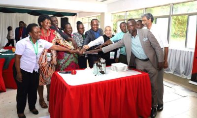EASLIS Dean, Alumni and staff cutting a cake to celebrate 60 years on 10th November 2023 at Makerere University. Big Lab 2, Block B, College of Computing and Information Sciences (CoCIS), Makerere University, Kampala Uganda, East Africa.