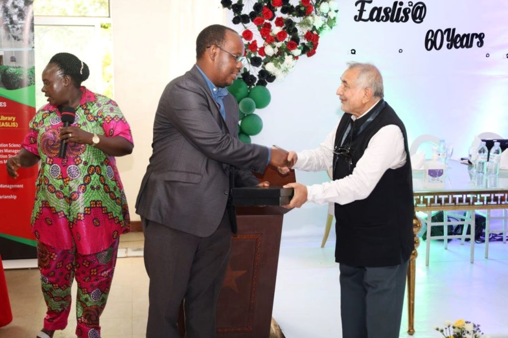 Prof. S. AH. Abidi receiving the Leadership Award. EASLIS@60 Luncheon, 10th November 2023, Big Lab 2, Block B, College of Computing and Information Sciences (CoCIS), Makerere University, Kampala Uganda, East Africa.