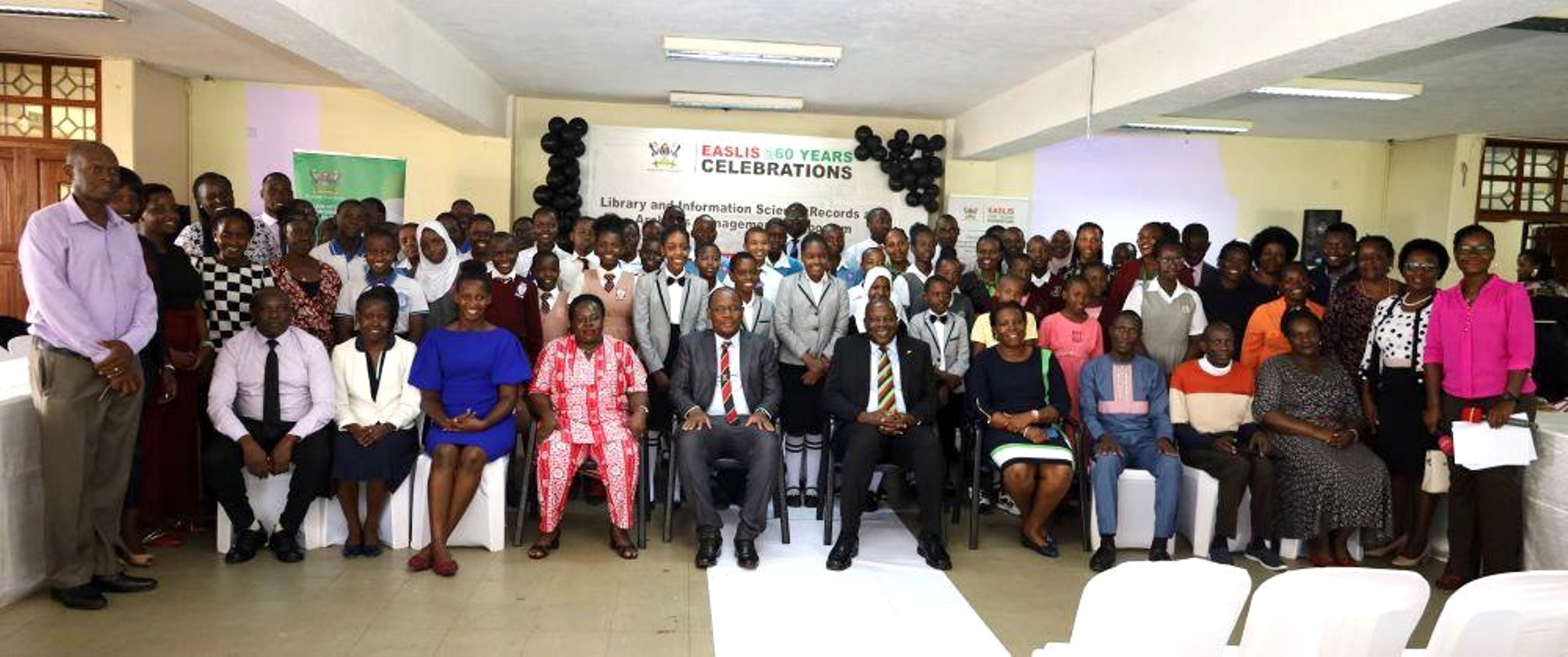 Primary and Secondary school students posing for a group photo with the College and School leadership on Day 1, 8th November 2023. EASLIS@60 Conference, 8th-10th November 2023, Big Lab 2, Block B, College of Computing and Information Sciences (CoCIS), Makerere University, Kampala Uganda, East Africa.