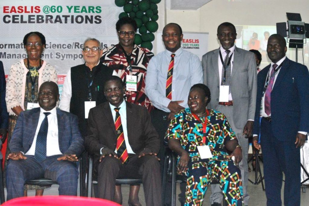 Hon. Muruli Mukasa (Seated Left) in a group photo with some Alumni. EASLIS@60 Conference, 8th-10th November 2023, Big Lab 2, Block B, College of Computing and Information Sciences (CoCIS), Makerere University, Kampala Uganda, East Africa.