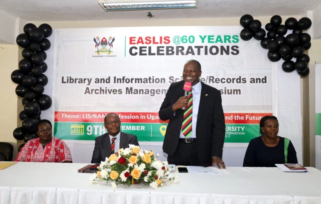 Prof. Tonny Oyana (Standing) making his opening remarks on day 1. EASLIS@60 Conference, 8th-10th November 2023, Big Lab 2, Block B, College of Computing and Information Sciences (CoCIS), Makerere University, Kampala Uganda, East Africa.