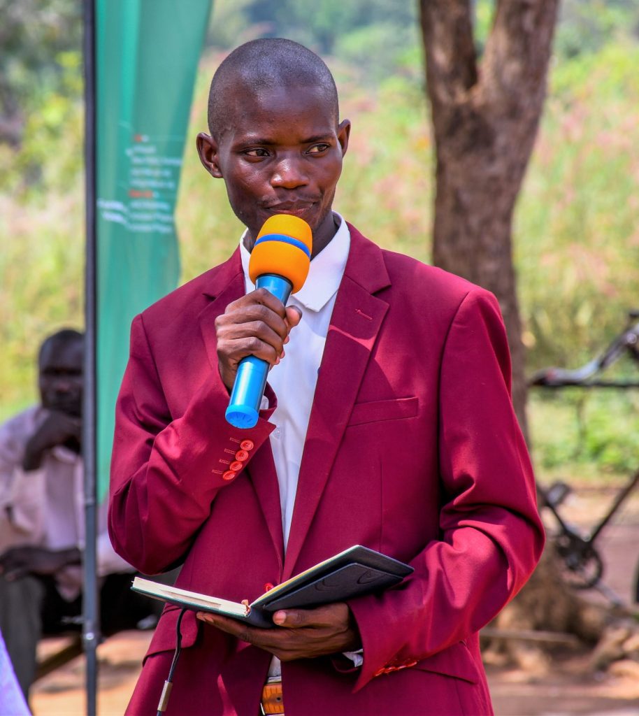 Mr. Raymond Eryebu, the Headteacher of Achukudu Primary School addressing the gathering. Makerere University Mastercard Foundation Scholars and Alumni Annual Day of Community Service (Giveback), 2nd December 2023, Achukudu Community Primary School, Napak District, Karamoja, Uganda, East Africa.