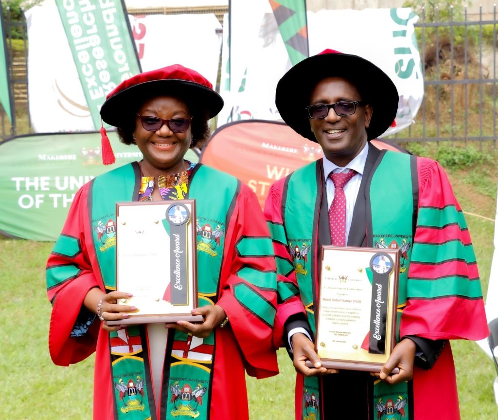 Professor Moses Robert Kamya (Right) and Professor Rhoda Wanyenze (Left) the Best Overall Male and Female Researchers at Makerere University respectively showcase their plaques. 74th Graduation Ceremony, Day 1, 29th January 2024, School of Public Health, College of Health Sciences (CHS), Freedom Square, Makerere University, Kampala Uganda, East Africa.