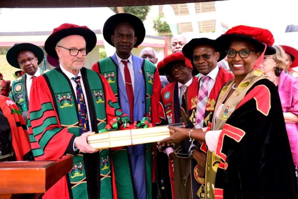 The Chairperson, Makerere University Council, Mrs. Lorna Magara (Right) presenting souvenirs to Prof. Abrahamsson. 74th Graduation Ceremony, Day 1, 29th January 2024, Freedom Square, Makerere University, Kampala Uganda, East Africa.