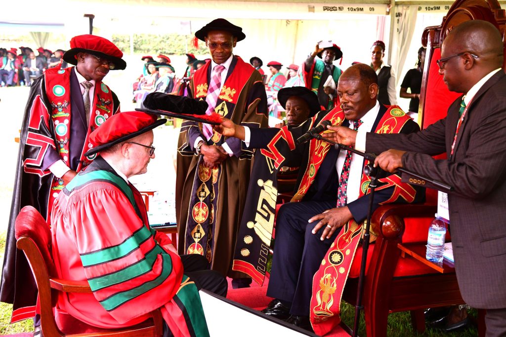 Prof. Abrahamsson receiving his award from the Acting Chancellor, also Vice Chancellor of Makerere University, Prof. Barnabas Nawangwe. 74th Graduation Ceremony, Day 1, 29th January 2024, Freedom Square, Makerere University, Kampala Uganda, East Africa.