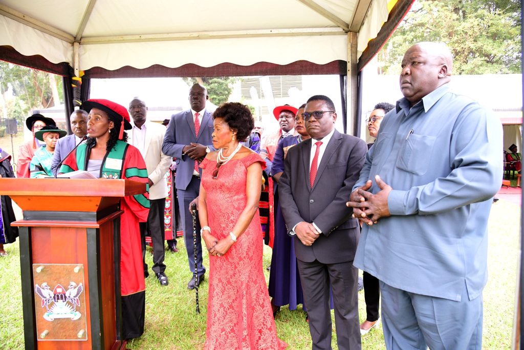 The Orator-Assoc. Prof. Rose Nakayi reads the citation flanked by (Right to Left) Hon. Okello Oryem Henry, Hon. Norbert Mao, Hon. Betty Oyella Bigombe, members of her family and other officials. 74th Graduation Ceremony, Day 1, 29th January 2024, Freedom Square, Makerere University, Kampala Uganda, East Africa.