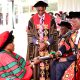 The Vice Chancellor, Prof. Barnabas Nawangwe (Right) presents Hon. Betty Oyella Bigombe (Left) with the Honorary Doctor of Laws, Honoris Causa of Makerere University as the Deputy Vice Chancellor (Academic Affairs), Prof. Umar Kakumba (2nd Left) witnesses on Day 1 of the 74th Graduation Ceremony on 29th January 2024. 74th Graduation Ceremony, Day 1, 29th January 2024, Freedom Square, Makerere University, Kampala Uganda, East Africa.