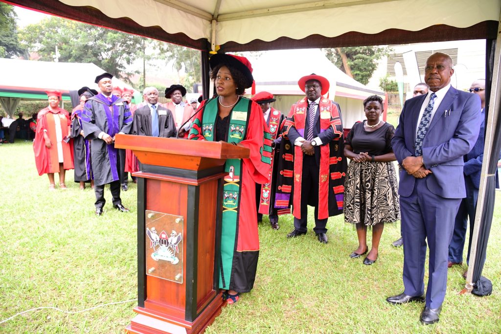 The Orator-Dr. Josephine Ndagire reads the citation flanked by Hon. Justice Frederick Martin Stephen Egonda-Ntende (Right), members of his family and other officials. 74th Graduation Ceremony, Day 1, 29th January 2024, Freedom Square, Makerere University, Kampala Uganda, East Africa.