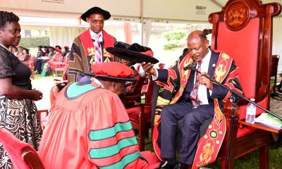 The Vice Chancellor, Prof. Barnabas Nawangwe (Right) confers the Honorary Doctor of Laws, Honoris Causa of Makerere University upon Hon. Justice Frederick Martin Stephen Egonda-Ntende (Left) as the Deputy Vice Chancellor (Academic Affairs), Prof. Umar Kakumba (2nd Right) witnesses on Day 1 of the 74th Graduation Ceremony on 29th January 2024. 74th Graduation Ceremony, Day 1, 29th January 2024, Freedom Square, Makerere University, Kampala Uganda, East Africa.