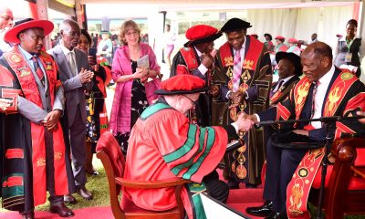 The Vice Chancellor, Prof. Barnabas Nawangwe (Right) shakes hands with Prof. Leif Abrahamsson after conferring upon him the Honorary Doctor of Science, Honoris Causa of Makerere University as members of his family and staff from the College of Natural Sciences and Department of Mathematics applaud on Day 1 of the 74th Graduation Ceremony on 29th January 2024. 74th Graduation Ceremony, Day 1, 29th January 2024, Freedom Square, Makerere University, Kampala Uganda, East Africa.