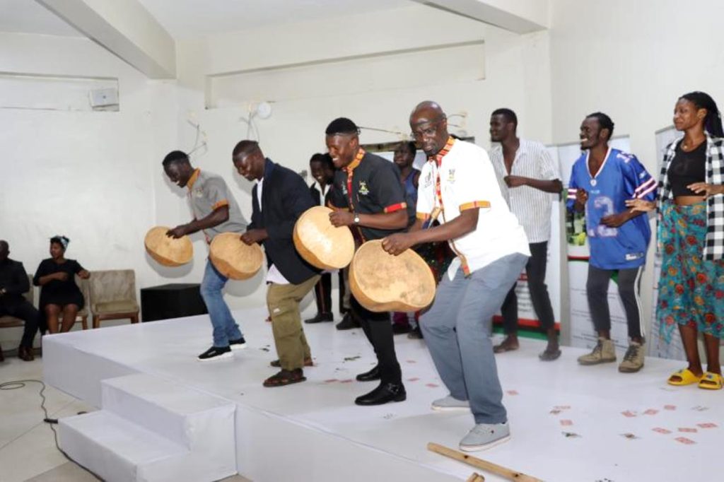 Mak PAF students directed by Dr. Milton Wabyona (Front Right) entertaining the guests. National convention to foster national conversation on floating populations, specifically the Aguu phenomenon, 14th December 2023, Fairway Hotel, Kampala Uganda, organised by CHUSS and Amani Institute.
