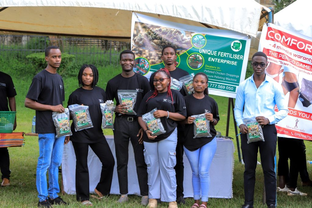 Some of the student entrepreneurs show off their Unique Fertiliser Enterprise at the Exhibition. Freedom Square, Makerere University, Kampala Uganda, East Africa.