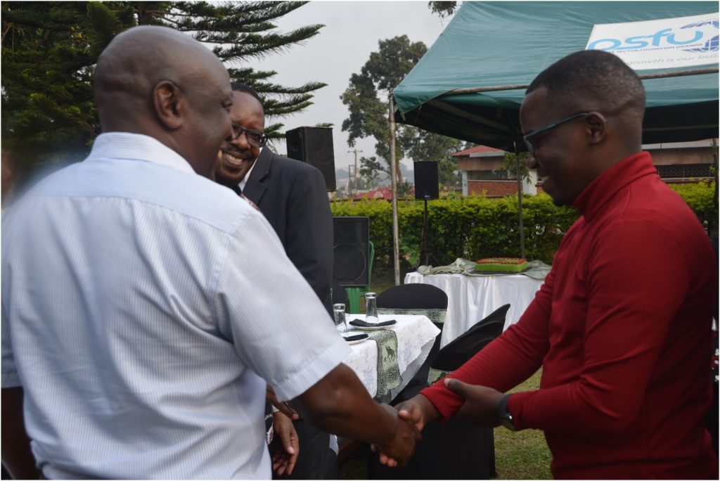A handshake with Dr. Paul Sajjakambwe (R) was in order. CoVAB farewell for outgoing staff, 19th January 2024, Ruth Keesling Gardens, College of Veterinary Medicine, Animal Resources and Biosecurity (COVAB), Makerere University, Kampala Uganda, East Africa.