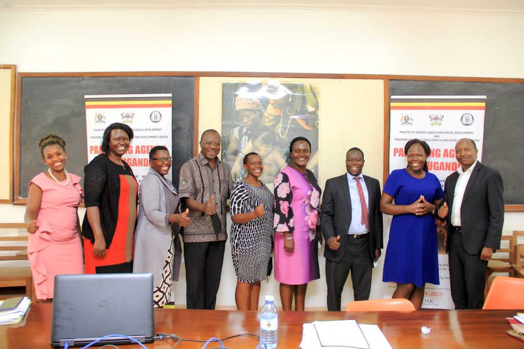 Stakeholders in the field of parenting pose for a picture in the CHDC conference room after an online meeting at CHDC. CHDC, School of Medicine, College of Health Sciences (CHS), Makerere University.