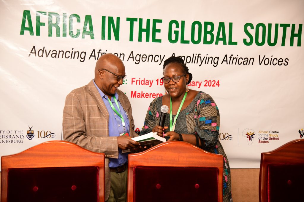 Prof. Gilbert Khadiagala (Left) and Prof. Josephine Ahikire (Right) interact during the Forum. Mak & Wits-ACSUS "Africa in the Global South: Advancing African Agency, Amplifying African Voices" Forum, 19th January 2024, Council Room, Level 3, Frank Kalimuzo Central Teaching Facility, Makerere University, Kampala Uganda, East Africa.