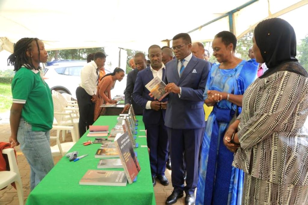 The Katikkiro Charles Peter Mayiga and the Nnaalinnya  and university officials tour the book exhibition. Department of African Languages, School of Languages, Literature and Communication International Mother Language Day Conference, Launch of Sir Edward Muteesa II Museum, on 21st February 2024, No. 95 Quarry Road & Yusuf Lule Central Teaching Facility Auditorium, Makerere University, Kampala Uganda, East Africa. 