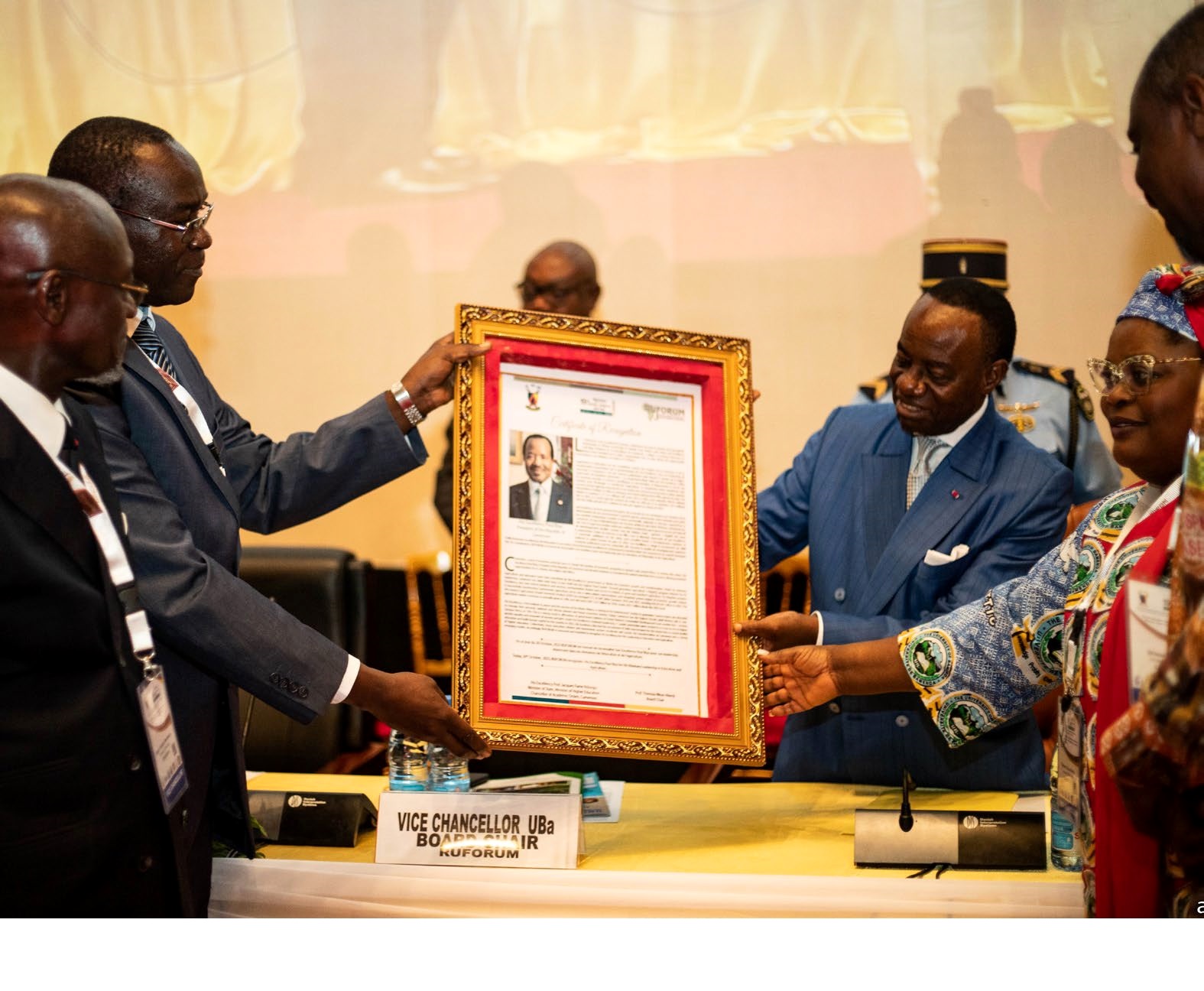 H.E. Professor Jacques Fame Ndongo, Cameroon's State Minister, Ministry of Higher Education, representing H.E. Paul Biya, President of the Republic of Cameroon (2nd Right) receives a plaque from the Executive Secretary, Professor Patrick Okori (2nd Left) at the opening ceremony of the 19th RUFORUM AGM. Yaounde, Cameroon, Central Africa.