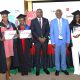 The Vice Chancellor-Prof. Barnabas Nawangwe, Principal CoBAMS-Prof. Eria Hisali, Dr. Felix Wamono and CEO of Prudential Assurance-Mr Tetteh Ayitevie with the top five Actuarial Science students of the 74th Graduation Ceremony. Prudential Assurance, ACCA Uganda and EPRC award ceremony for best performing business graduates, 12th March 2024, Conference Room, Room 2.2B, Level 2, School of Business, College of Business and Management Sciences (CoBAMS), Makerere University, Kampala Uganda, East Africa.