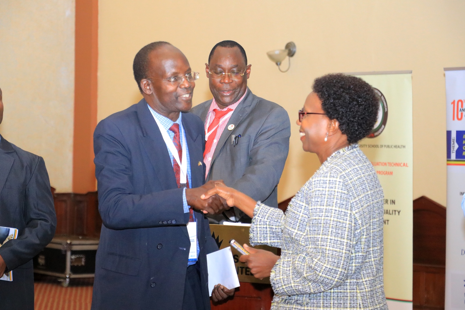 The Minister of Health-Hon. Dr. Jane Ruth Aceng Ocero (Right) shakes hands with Prof. Christopher Garimoi Orach during the launch event on 12th March 2024. Launch of the first ever Harmonized Health Facility Assessment (HHFA) jointly conducted by the School of Public Health, Makerere University, Kampala UgandaH and the Ministry of Health during the 10th Annual National Health Care Quality Improvement Conference, 12th March 2024, Imperial Resort Beach Hotel, Entebbe Uganda, East Africa.