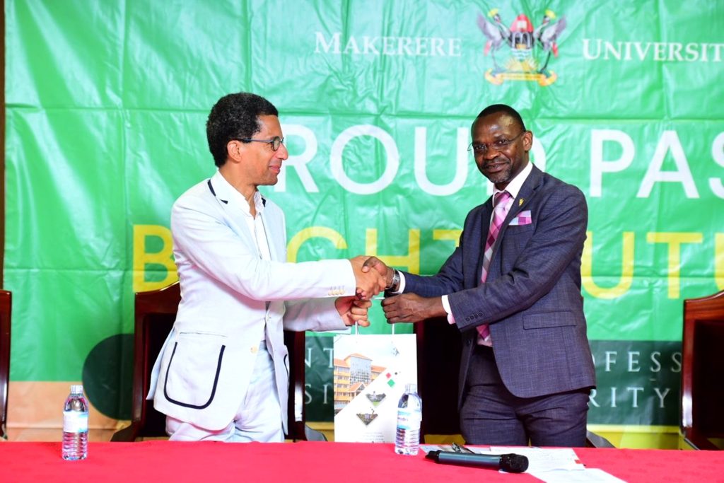Prof. Umar Kakumba (Right) presents an assortment of Makerere Souvenirs to H.E. Xavier Sticker (Left). French Study and Campus Fair Meeting, 7th March 2024, The Council Room, Level 3, Frank Kalimuzo Central Teaching Facility, Makerere University, Kampala Uganda, East Africa.