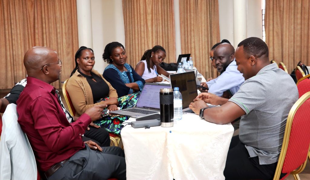 Some of the participants engaged in a group discussion. EfD-Makerere University Center, Kampala Uganda, training to identify research and data gaps to address the persistent environmental and natural resources (ENR) challenges in Uganda, 14th to 15th March 2024, Esella Country Hotel.