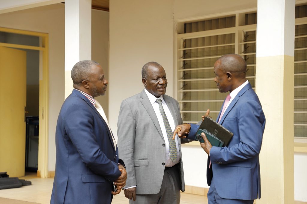 Prof. Eria Hisali, Mr. Deo JB Kayemba and an UMA official chat after the ceremony. Makerere University College of Business and Mangement Sciences (CoBAMS)-Uganda Manufacturers Association (UMA) Industrial Research MoU Signing Ceremony, 27th February 2024, Nakawa, Kampala Uganda, East Africa.