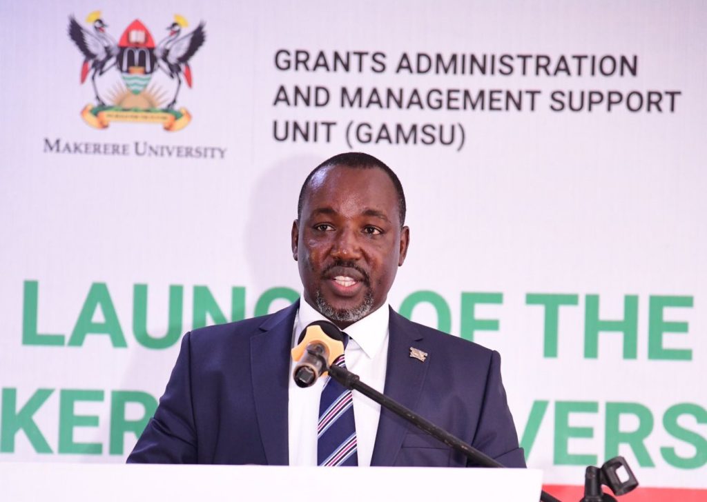 The Chairperson FPAIC, Mr. Bruce Kabaasa addresses the audience at the launch. Makerere University Grants Management System (MakGMS) Launch, 12th March 2024, School of Food Technology, Nutrition and Bioengineering (SFTNB) Conference Hall, CAES, Kampala Uganda, East Africa.