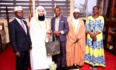 Ag. Vice Chancellor-Prof. Umar Kakumba (Centre) presents Mak Souvenirs to Mufti Ismail ibn Musa Menk (2nd Left) as Right to Left: Dean of Students-Mrs. Winifred Kabumbuli, University Imaam-Dr. Sowed Juma Mayanja and MUMSA Patron-Dr. Muhammad Kiggundu Musoke witness on 8th March 2024. Mufti Menk Visit and Public Lecture, 8th March 2024, Frank Kalimuzo Central Teaching Facility, Makerere University, Kampala Uganda, East Africa.