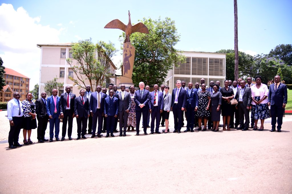 Members of the University Management and the delegation from Western University, Ontario, Canada pose for a group photo at the Makerere@100 Monument. 18th March 2024, Makerere University, Kampala Uganda, East Africa.