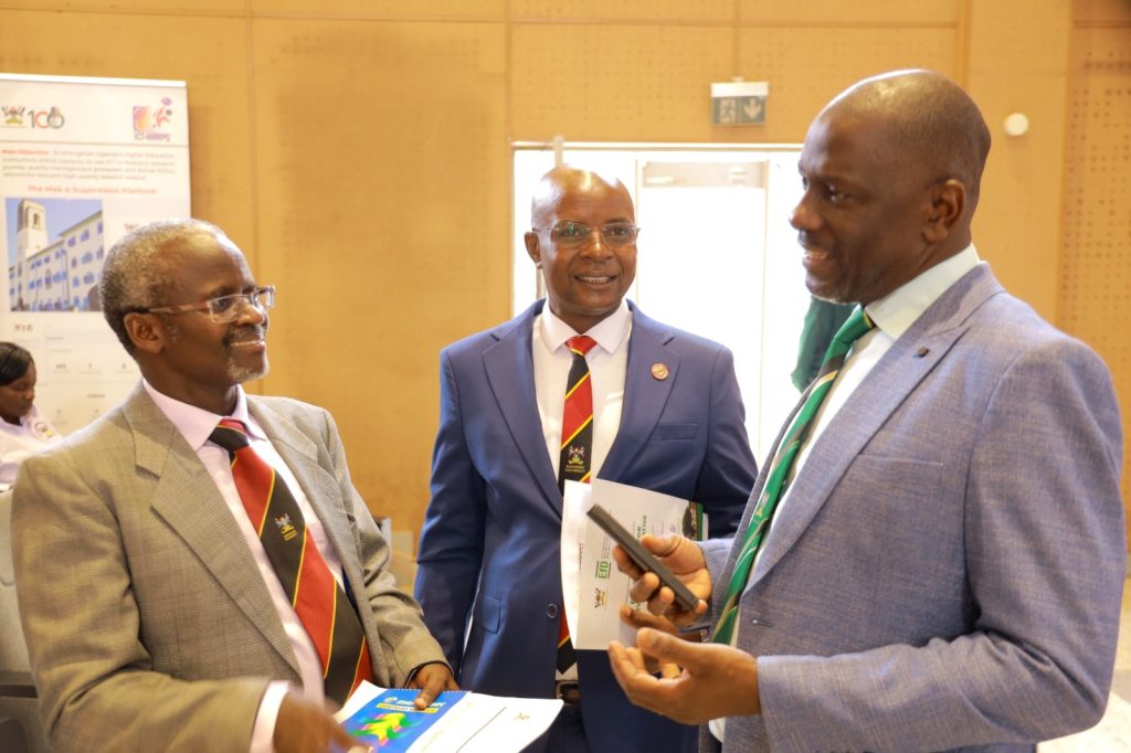 Annual Forum for Graduate Research and Prof. Edward Bbaale (Centre) chats with Prof. Julius Kikooma (Right) and Dr. William Tayeebwa (Left) at the event. Policy Dialogue, 25th April 2024, Yusuf Lule Central Teaching Facility Auditorium, Makerere University, Kampala Uganda, East Africa.