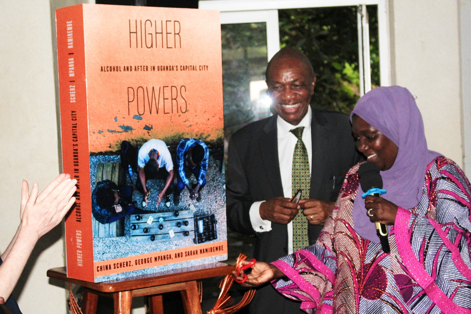 Dr. Hafsa Lukwata, the Assistant Commissioner for Health Mental Health and Center of Substance Abuse at the Ministry of Health, launches the book on behalf of the Permanent Secretary, Dr. Diana Atwine on 26th April 2024. Launch of Higher Powers: Alcohol and After in Uganda's capital city book by Sarah Namirembe, George Mpanga and UVA's Associate Professor China Scherz, 26th April 2024, Conference Hall, School of Food Technology, Nutrition and Bioengineering, CAES, Makerere University, Kampala Uganda, East Africa.