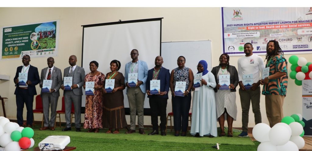 Representatives from government institutions, non-profit organizations, civil society organizations, and academia pose for a photo after launching the Wakiso District Human Rights Report for the year 2023 at CoVAB. The Roots Africa University Clubs’ exhibition and mentorship engagement and launch of the Wakiso District Human Rights Report for the year 2023 hosted by The INNOVETS, 11th May 2024, College of Veterinary Medicine, Animal Resources, and Biosecurity (CoVAB), Makerere University, Kampala Uganda, East Africa.