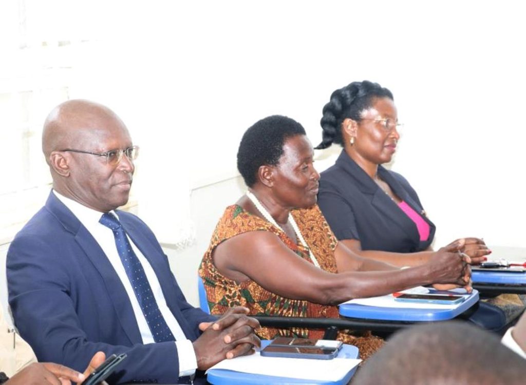 Prof. Nkabala's uncle (Left)  and mother (Centre) witnessing the handover. Prof. Josephine Ahikire Hands Over College of Humanities and Social Sciences (CHUSS) Leadership to Assoc. Prof. Helen Nambalirwa Nkabala, 31st May 2024, CHUSS Smart room, Makerere University, Kampala Uganda, East Africa.
