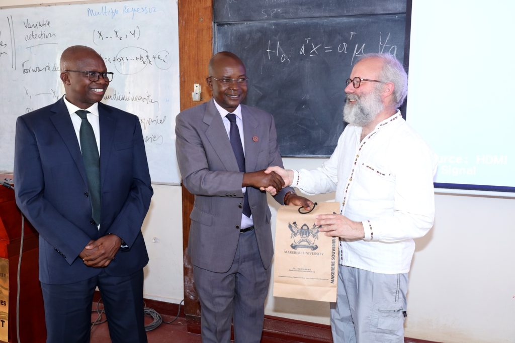 Prof. Edward Bbaale (Centre) and Prof. James Wokadala (Left) hand over a gift to Prof. Bruno Scarpa (Right). Makerere University School of Statistics and Planning-University of Padova, Italy dynamic workshop on multivariate statistics and time series analysis, 11th to 20th June 2024, Makerere University, Kampala Uganda, East Africa.