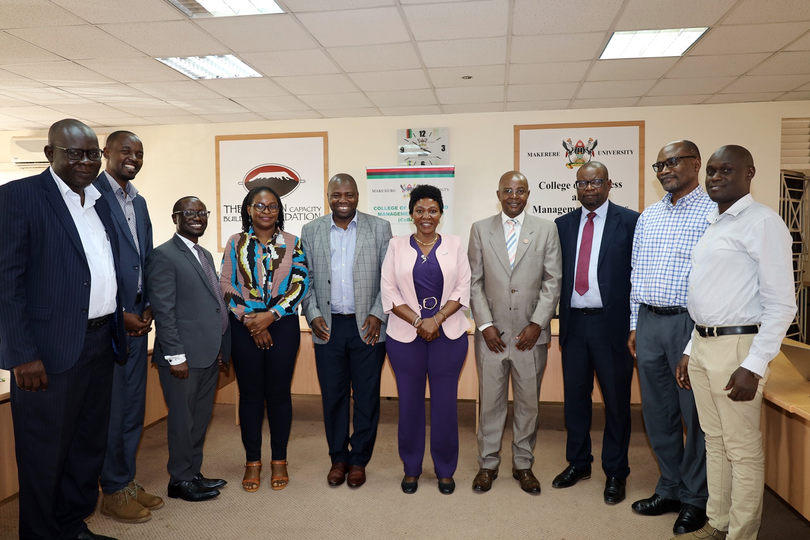 Prof. Godfrey Akileng (L), Ms. Fiona Luswata from UNCDF (4th L), Dr. Eric Nzibonera (5th L), Ms. Jennifer Bukokhe (5th R), Prof. Edward Bbaale (4th R), Dr. Mkhululi from UNCDF (3rd R), Prof. Bruno Yawe (2nd R) and other officials at the meeting. Visit by officials from the United Nations Capital Development Fund (UNCDF) to the College of Business and Management Sciences (CoBAMS) to bolster their longstanding partnership, 18th June 2024, Conference Room, Room 2.2B, Level 2, School of Business, College of Business and Management Sciences (CoBAMS), Makerere University, Kampala Uganda, East Africa.