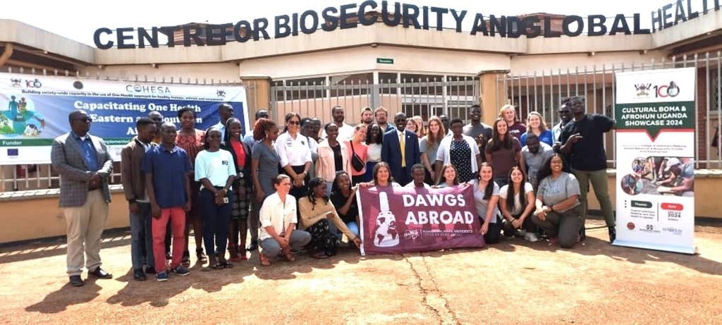 Participants pose for a group picture in front of the Centre for Global Health, CoVAB. The 2024 Summer School and the International Cultural Boma and AFROHUN Showcase, June 20th, 2024, Ruth Keesling Centre, College of Veterinary Medicine, Animal Resources, and Biosecurity (CoVAB), Makerere University, Kampala Uganda, East Africa.