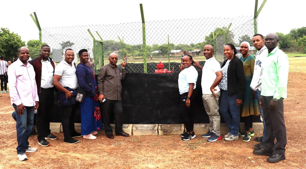 Prof. Johnny Mugisha (5th Left) with other members of the team at the first Oil driller sunk by Tullow Oil at Kasamene Site. Environment for Development Initiative (EfD-Mak) Centre, Makerere University, Field Visit to Albertine Oil Fields, Hoima, Buliisa and Kikuube Districts, Uganda, East Africa, aimed at bridging gap between academic research and practical applications, focusing on the interaction between oil extraction activities and local communities, environmental management and sustainable development. 17th-20th July 2024.