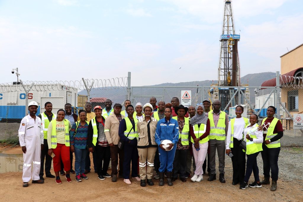The Team at the Kingfisher oil well. Environment for Development Initiative (EfD-Mak) Centre, Makerere University, Field Visit to Albertine Oil Fields, Hoima, Buliisa and Kikuube Districts, Uganda, East Africa, aimed at bridging gap between academic research and practical applications, focusing on the interaction between oil extraction activities and local communities, environmental management and sustainable development. 17th-20th July 2024.